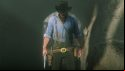 A cowboy with his gun drawn