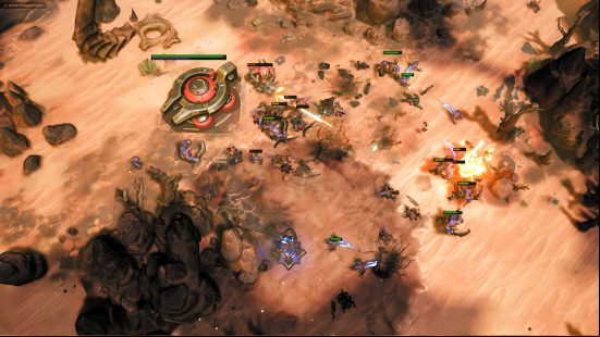 Stormgate gameplay - Human Resistance and Infernal Host forces clash on a sandy, rocky, arid map.
