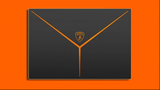 Razer Blade 16 x Automobili Lamborghini reveal: the back of a laptop displaying a Lamborghini logo and three pointed orange shape appears against an orange background.