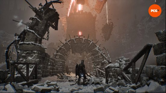 The lampbearer is walking across a castle wall, looking at one of the Lords of the Fallen beacons at the top of the tower ahead of him.