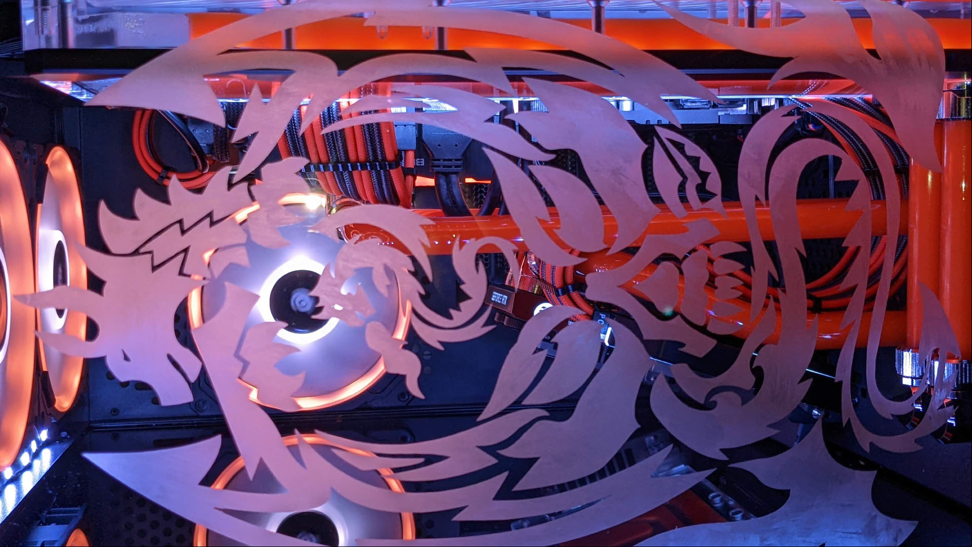 The dragon etching on the gaming PC glass