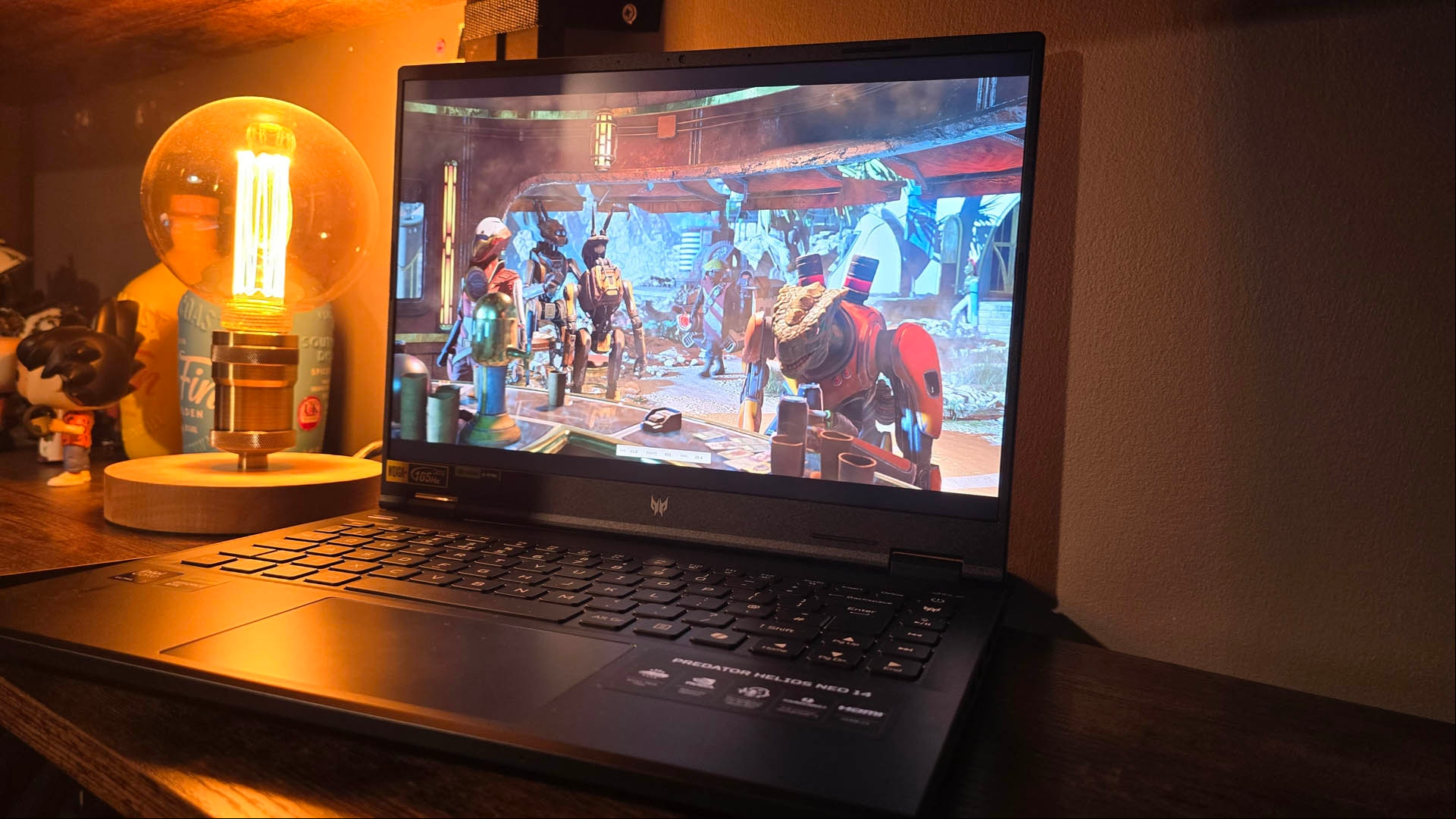 Acer Predator Helios Neo 14 review image showing the laptop in a darkened room.