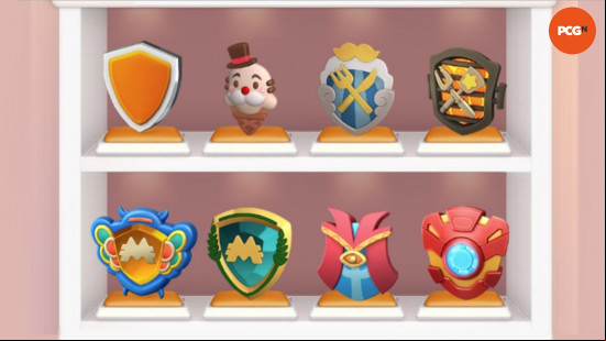 Two shelves filled with some of the Monopoly Go Shields, including Ice Cream Cone, Iron Man, and the default shield.