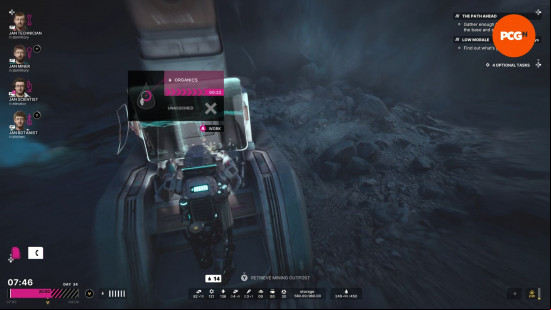 The Alters review: a man in a space suit stands at a mining station, operating a computer terminal.